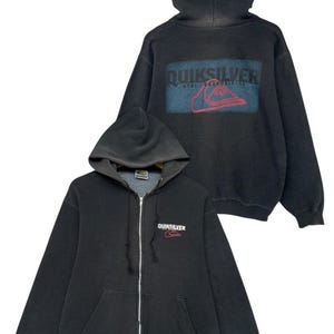 May include: Black zip-up hoodie with a large "QUIKSILVER" logo on the back and a smaller logo on the front. The hoodie has a drawstring hood and a kangaroo pocket.