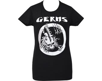 May include: Black t-shirt with the word "GERMS" in white, above a circular graphic. The graphic features a skull with a mohawk and skeletal hands breaking through a white circle. The shirt has short sleeves.