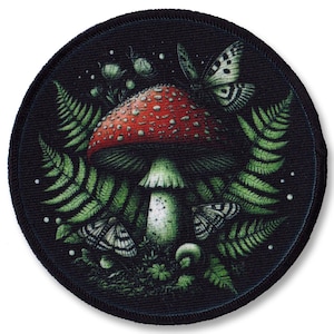 May include: A round black patch featuring a red and white mushroom surrounded by green ferns and butterflies. The mushroom has white spots on its red cap.