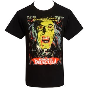 Black t-shirt with bold vintage-style Horror of Dracula movie poster graphic featuring Dracula with fangs and blood on mouth.