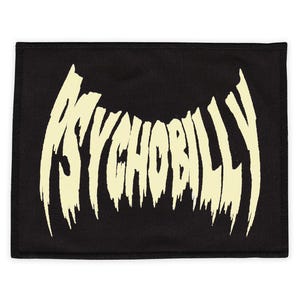 Puede incluir: Parche de tela negro con el texto "PSYCHOBILLY" en una fuente blanca que gotea.