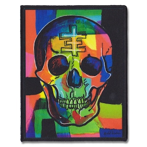 May include: A colorful skull with a cross symbol on its forehead, surrounded by abstract geometric shapes in bright colors like red, yellow, green, blue, and purple. The skull is outlined in black and has a white background.