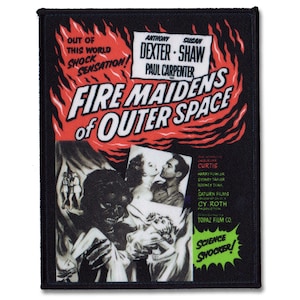 May include: A vintage movie poster for the film "Fire Maidens of Outer Space." The poster features a red and black colour scheme with flames and a title in bold white letters. The poster also includes the names of the actors, Anthony Dexter, Susan Shaw, and Paul Carpenter.