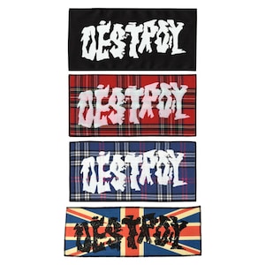 May include: Four different patches with the word "DESTROY" printed on them. The patches are in different styles, including black, red and black tartan, blue and white tartan, and a Union Jack pattern.