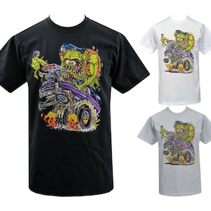 May include: Three t-shirts in black, white, and gray, each featuring a colorful cartoon graphic. The graphic depicts a green monster driving a purple hot rod with flames. The monster has blue hair and a large grin.