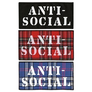 May include: Three fabric patches with the words "ANTI-SOCIAL" printed in white on a black, red and blue tartan background.