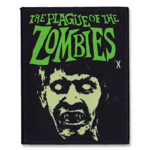 May include: Black rectangular patch featuring the text "THE PLAGUE OF THE ZOMBIES" in green, above a zombie face illustration. The zombie face is pale green with white eyes and visible teeth. The patch has a black border.