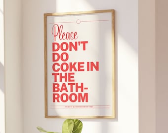 May include: A framed print with the text "Please Don't Do Coke In The Bath-Room" in red letters on a white background.