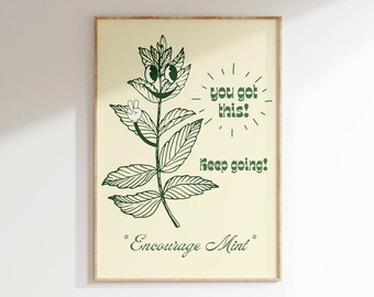 May include: A framed print with a green illustration of a smiling mint plant with the text "You got this! Keep going! *Encourage Mint*"