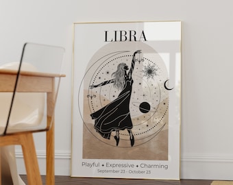 May include: A framed Libra zodiac art print. The artwork features a black silhouette of a dancing figure, set against a beige and white background with celestial elements. Text includes "LIBRA" and "Playful + Expressive + Charming."