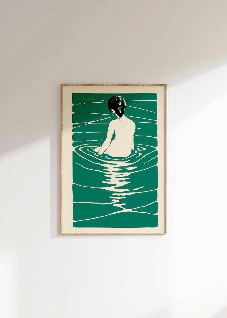 May include: A minimalist art print featuring a woman sitting in a pool of water. The woman is depicted in white, while the water is a deep green color. The print has a simple, modern aesthetic.