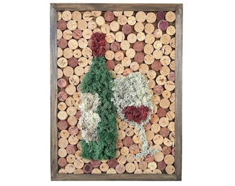 May include: A framed wall art piece made of cork with a wine bottle and wine glass design. The bottle and glass are made of green and red moss.