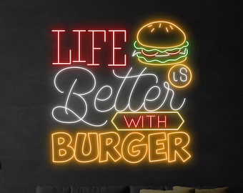 May include: Neon sign with the text "Life is Better with Burger" in yellow, white, and red. A yellow neon burger is above the text.