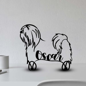 May include: Black metal silhouette of a Shih Tzu dog with the name "Oscar" written underneath. The silhouette is on a white background.