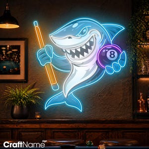 May include: A neon sign featuring a cartoon shark holding a pool cue and an eight ball. The shark is blue and white with a menacing grin. The eight ball is purple with a white number 8. The sign has the text "CraftName" at the bottom.