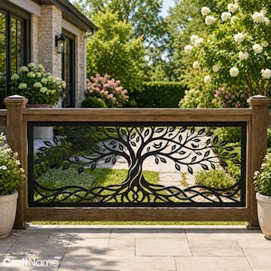 May include: A rectangular black metal panel featuring a laser-cut design of a tree with intricate branches, leaves, and roots. The panel is mounted within a wooden railing frame, positioned outdoors on a stone patio with greenery in the background.
