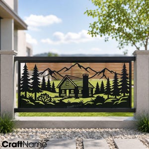 May include: A black metal decorative fence panel featuring a laser-cut design of a cabin nestled among pine trees with a mountain range in the background. The text CraftName is visible in the lower center of the panel and at the bottom left.
