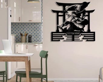 May include: A black metal wall art piece featuring a silhouette of two figures engaged in a Brazilian Jiu-Jitsu grappling match. The design includes a traditional Japanese torii gate in the background and a horizontal bar labeled CUSTOM NAME.