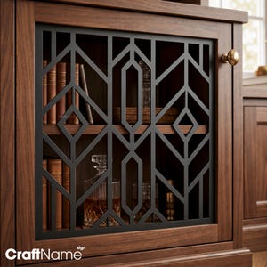 May include: A dark wood cabinet featuring a black metal door insert with a geometric lattice pattern. The cabinet has a round brass knob and interior shelves holding several books, a glass decanter filled with amber liquid, and a glass.