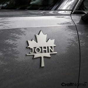 Emblema metálico de hoja de arce para coche, insignia para vehículos, decoración de camiones y accesorios para automóviles.