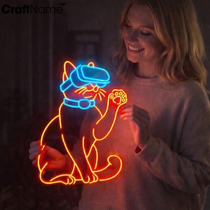 May include: Neon sign featuring a cat wearing VR goggles. The sign is outlined in orange and red, with blue accents on the goggles and collar. The cat is holding up a paw. The sign has the text "CraftName sign" in the upper left corner.