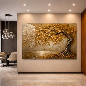 May include: A large, rectangular wall art piece featuring a textured, golden tree with cascading leaves. The artwork depicts a serene landscape with a reflective body of water. The tree's trunk is a dark brown, contrasting with the gold foliage.