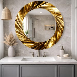 May include: A round mirror with a gold, swirling frame. The mirror is mounted above a bathroom vanity with a white countertop and gray cabinets. The frame has a textured, metallic appearance.