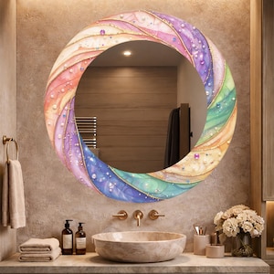 May include: A round, decorative mirror with a colorful, abstract design. The mirror's frame features a rainbow of colors, including pink, purple, blue, and green, with gold accents and small, pearl-like embellishments. The mirror is mounted above a bathroom sink.