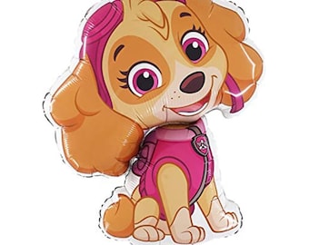 May include: A foil balloon shaped like a cartoon dog character with large pink eyes, tan fur, and long floppy ears. The dog wears a pink aviator-style cap, a matching pink vest with a small badge emblem on the chest, and has a smiling expression.