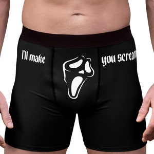 May include: Black boxer briefs with a white graphic of a screaming face and the text "I'll make you scream". The underwear has a black waistband.
