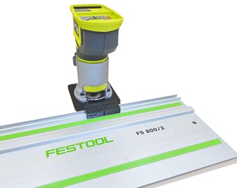 以下が含まれることがあります： 緑と黒のコードレスルーターが、Festool FS 800/2トラックシステムに取り付けられています。ルーターは、黒いガイドプレートを使用してトラックに配置されています。