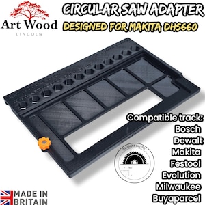 May include: A black rectangular circular saw adapter designed for Makita DHS660, featuring a series of hexagonal cutouts along one edge, a large central rectangular opening, and a single orange adjustment knob on the side for track alignment.