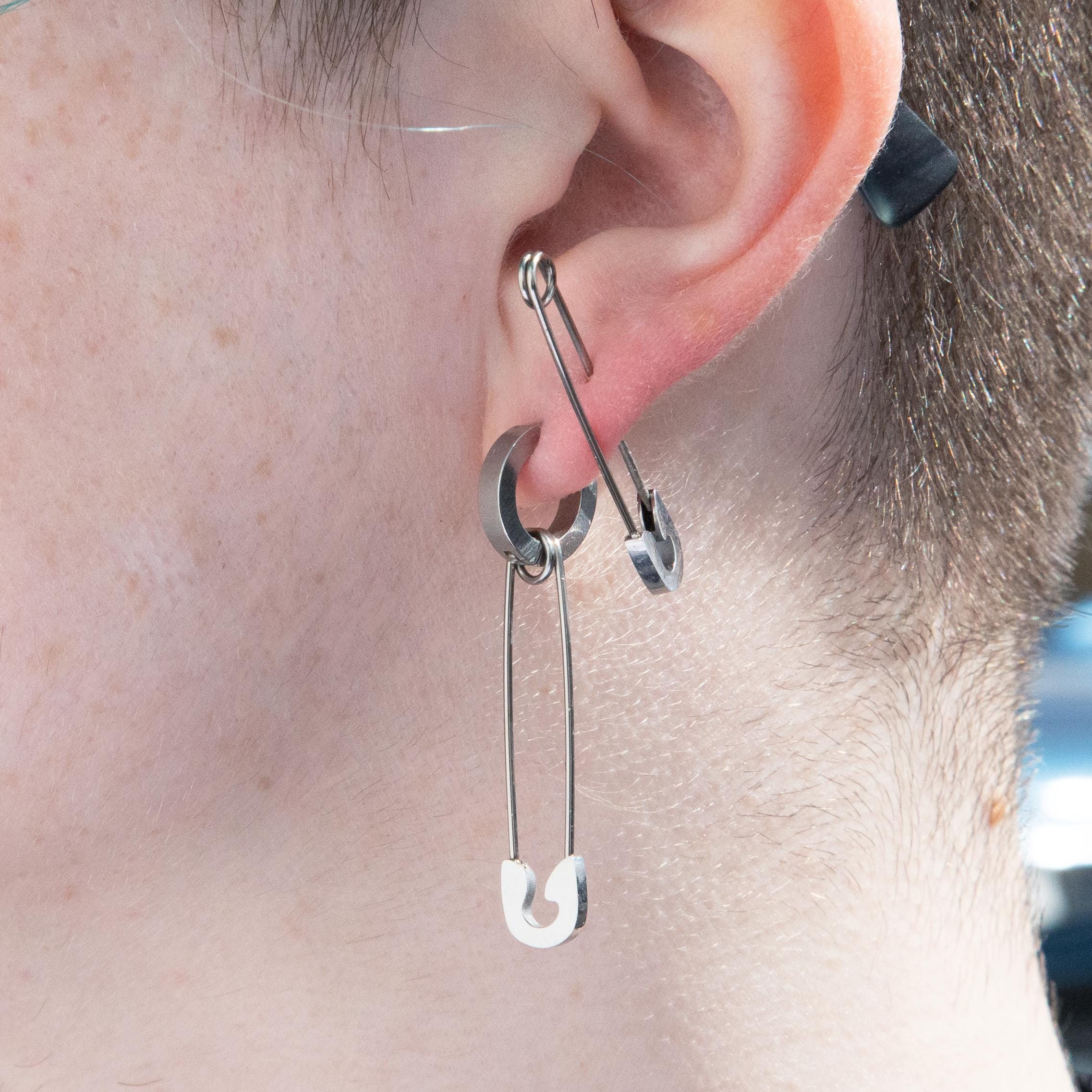 earring piercing piercing ear with safety pin