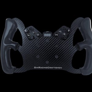 May include: A black racing steering wheel with a carbon fiber faceplate and a digital display. The wheel has multiple buttons and a SIMRACINGCRAFTSMEN logo.