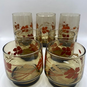 Libby St Clair stacking juice glasses. Brown glass with wheat and poppies.