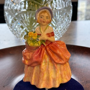 Royal Doulton miniature figurine &quot;Cissie&quot; HN 1809. Young girl with flowers.