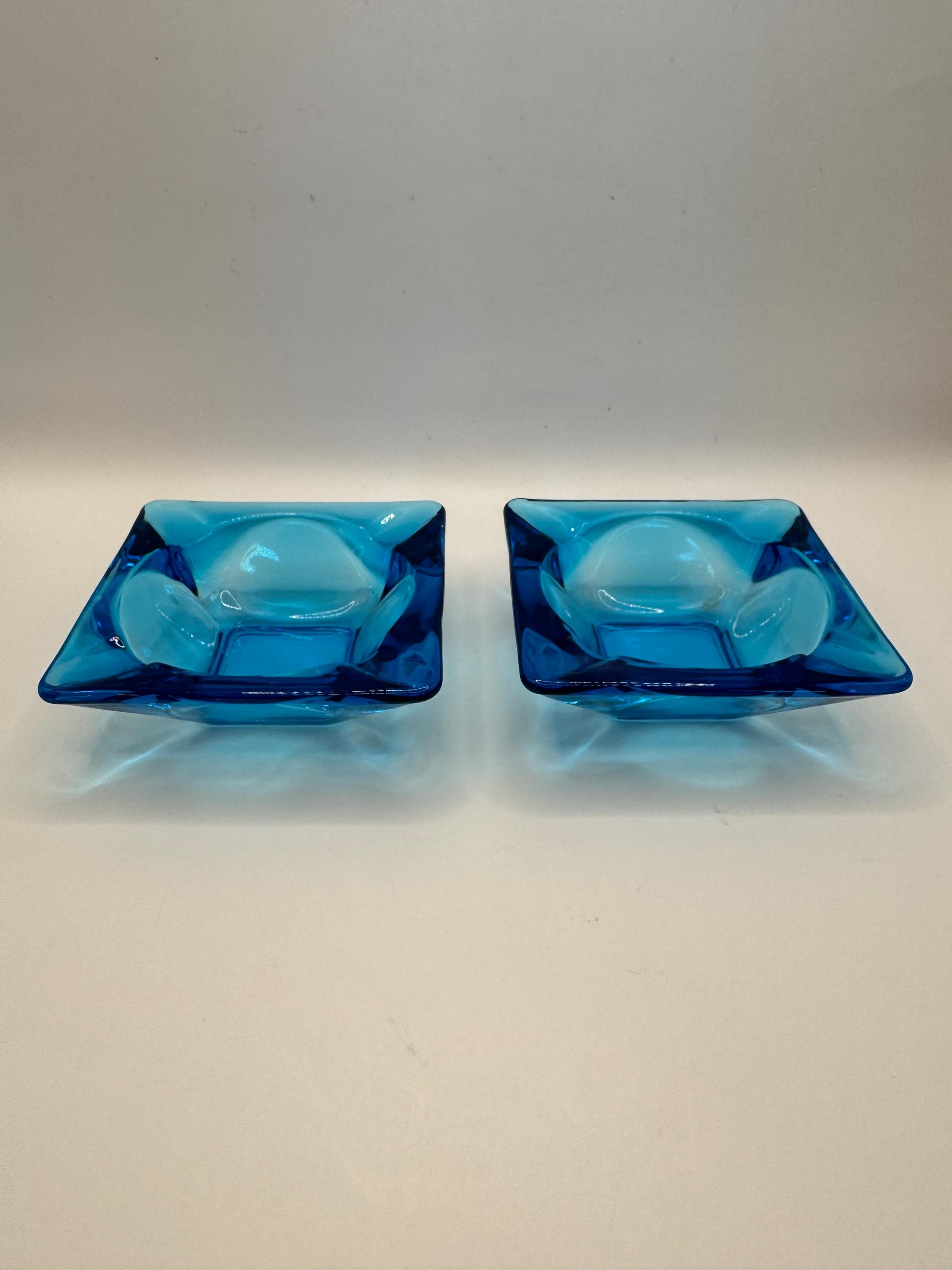 Mid century modern aqua blue glass ashtray. Set of 2 small blue ashtrays in excellent condition. 3.5" across.