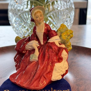 Royal Doulton miniature figurine &quot;Lydia&quot; HN 1808. Girl sitting in a garden.