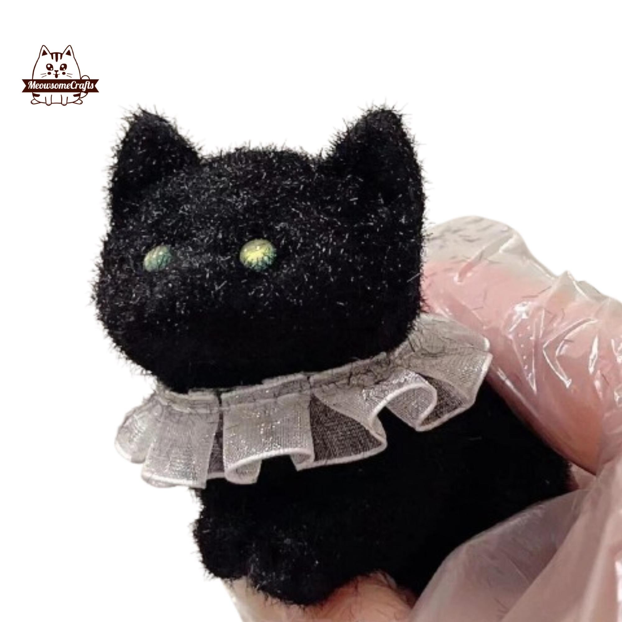 黒のふわふわ子猫猫の形をしたスクイーズ、握れるストレス解消感覚フィ