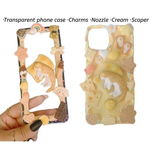 May include: A clear phone case with a yellow background and various 3D charms attached. The charms include a cat, a rainbow, a teddy bear, a star, a bow, ice cream, a cookie, and a chocolate bar. The text "Milk & Milk" is printed on the chocolate bar.