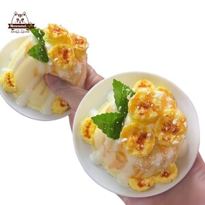 May include: Two white bowls filled with a dessert featuring yellow slices of caramelized bananas, white cream, and green mint leaves. The dessert is drizzled with a white sauce and sprinkled with a white powder. The logo "MeowsomeCrafts" is in the upper left corner.