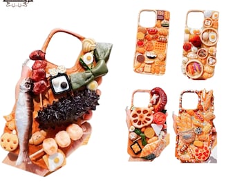 May include: Four different phone cases decorated with various food items. Each case features a different theme, including seafood, sushi, dim sum, and bread. The cases are all made of a soft, flexible material and have a clear back.