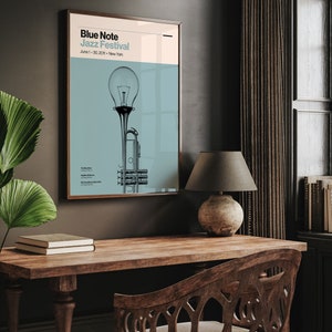 May include: A poster for the Blue Note Jazz Festival in New York City, featuring a stylized illustration of a trumpet and a light bulb. The poster is on a dark blue background with white text. The text reads "Blue Note Jazz Festival" and "June 1 - 30, 2020 - New York".