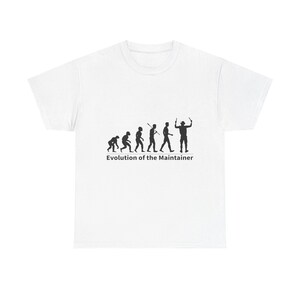 May include: White t-shirt with a black silhouette of the evolution of a maintainer, starting with a caveman and ending with a person holding a wrench. The text "Evolution of the Maintainer" is printed below the silhouettes.