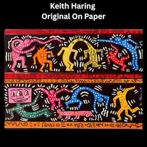 May include: A colorful artwork by Keith Haring, titled "Original On Paper." The image features stylized figures in various colors, including pink, orange, yellow, red, and blue, dancing against a black background. The artwork has a bold, graphic style.