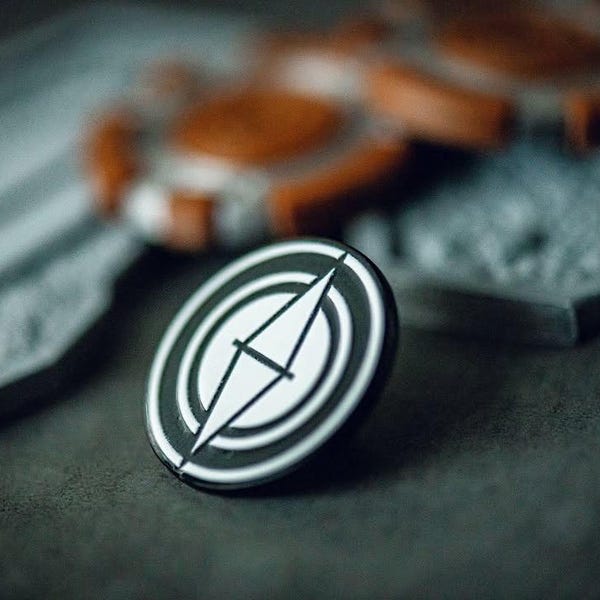 Sylop Pin – Minimalist 1-Inch Black Plated Enamel Pin