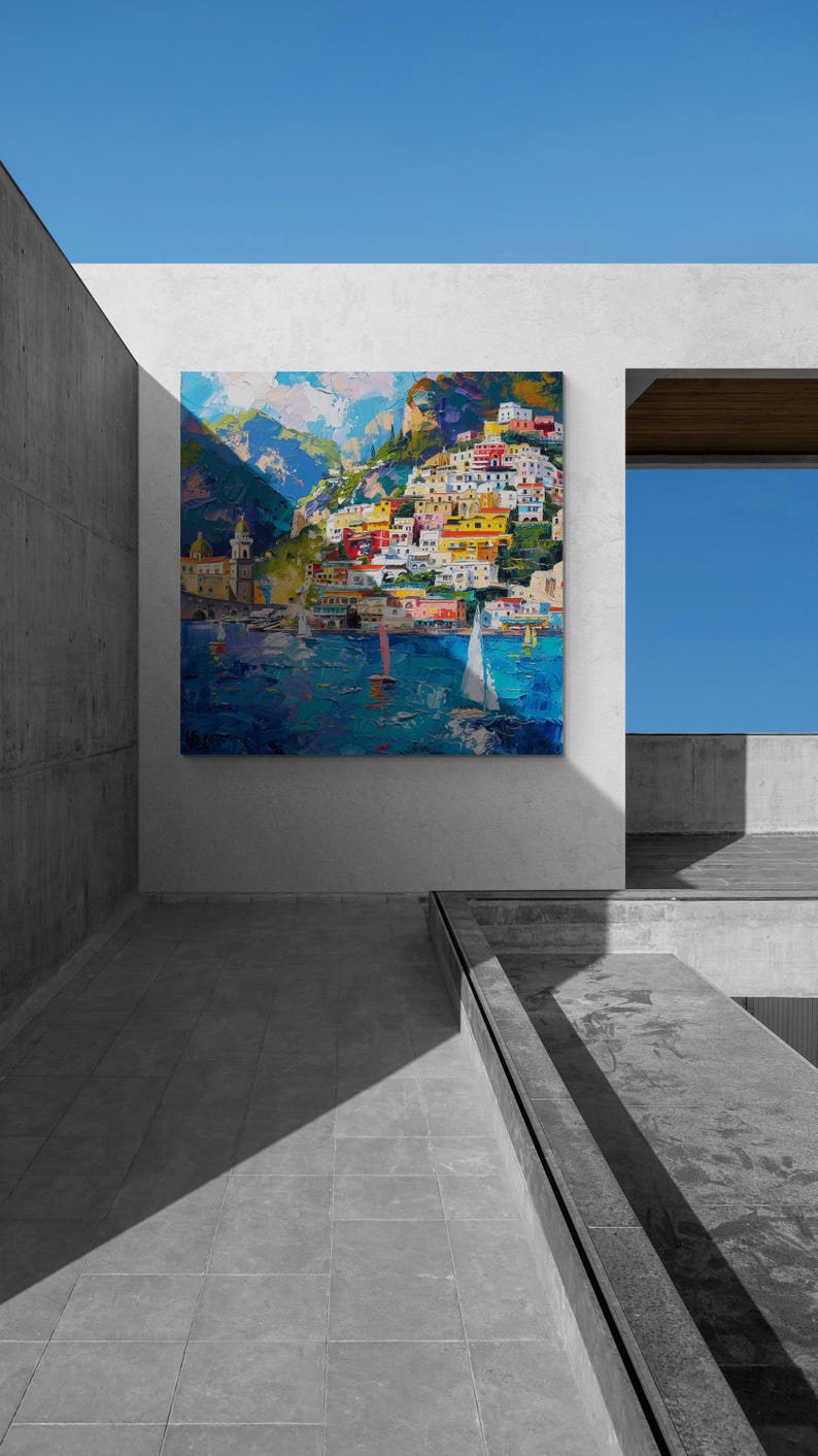 May include: A colorful painting of a seaside town with buildings on a hillside, boats in the water, and a blue sky.