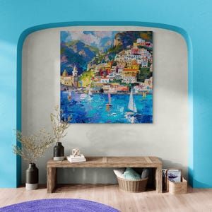 May include: A colorful painting of a seaside town with colorful buildings on a hillside, boats in the water, and a blue sky with clouds.