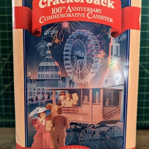 Vintage cracker Jack 100th Anniversary Tin Depicting vintage Americana scenes on all four sides