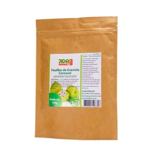 May include: A brown paper bag with a product label for Graviola Corossol leaves. The label features a green and white illustration of the fruit, the product name, and the weight of the product, 100g. The label also includes the origin of the product, Peru Amazonie, and the company name, Jida Market.